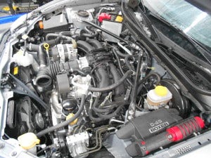 FR-S stock engine bay with intake removed 