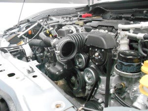 FR-S stock engine bay with intake removed 