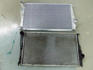 Mishimoto radiator (top) and stock radiator (bottom)