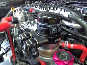 Mishimoto prototype of oil sandwich plate installed with banjo fittings