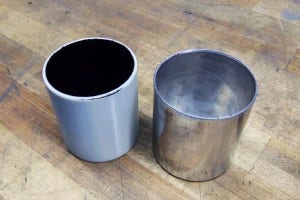 Fabricated catch can base (right) and 3D-printed base (left)
