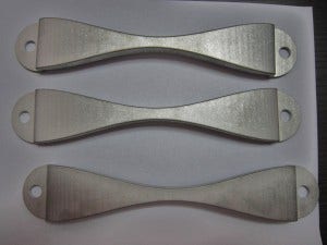 Mishimoto Subaru battery tie-down prototypes