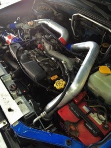 Mishimoto fabricated intercooler pipes on Bugeye