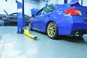 Launch Edition Subaru STI in Mishimoto garage 