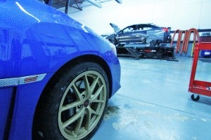Launch Edition Subaru STI in Mishimoto garage