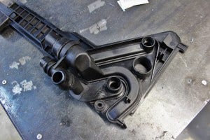 Automatic transmission radiator mounting plate