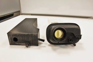 3D-printed Mishimoto expansion tank prototype (left) and stock expansion tank (right)