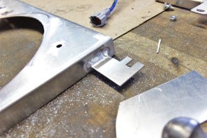 Shroud mounting tab fabrication