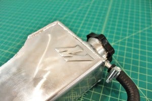 Mishimoto expansion tank logo