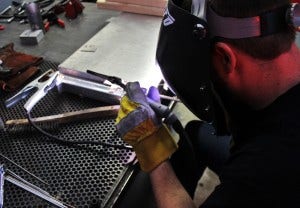 Shroud mounting tab welding