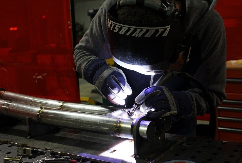 Mustang H-Pipe pieces resting in the jig
