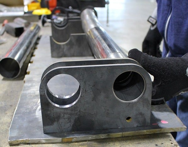 Mustang H-Pipe pieces resting in the jig 