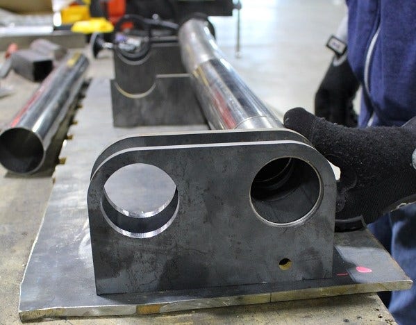 Mustang H-Pipe pieces resting in the jig