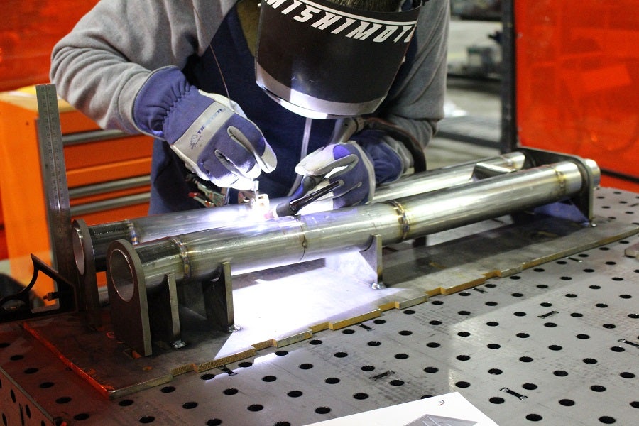 Mustang H-Pipe pieces resting in the jig