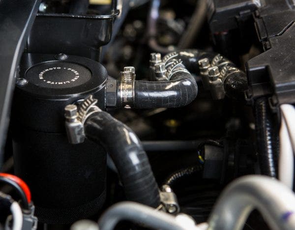 While this bend might look a little out of place, it looks better than it wiggling out of place. We could have designed this hose as a straight shot into the intake manifold, but that would leave barely any slack for when the engine moves around in the bay. 