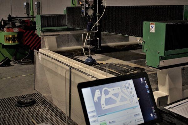 The waterjet is ready to cut out the design file