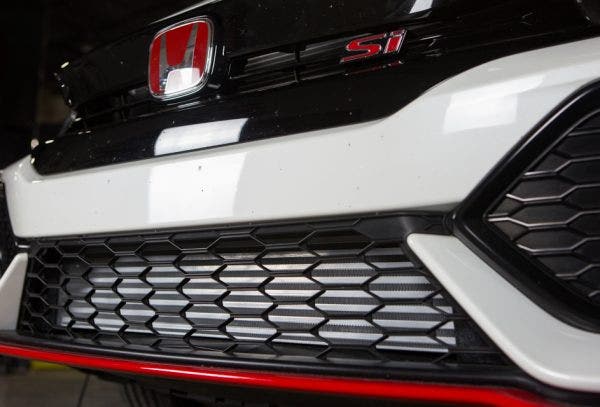 Even though the Si and Sport Hatch share the same front bumper cover, it never hurts to triple check your work. The taller and more prominent design complements the optional front lip on the Si.