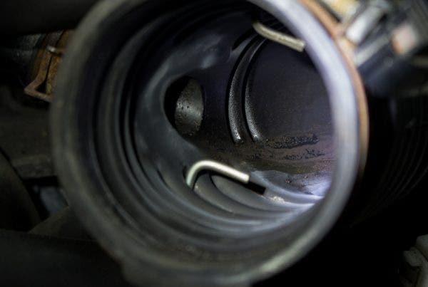 On a closer inspection of the Speed 3's PCV system, it was apparent that it's powerplant produced a significant amount of blow-by. That murky residue is only the remnants of what is passing through your intake system and intercooler.