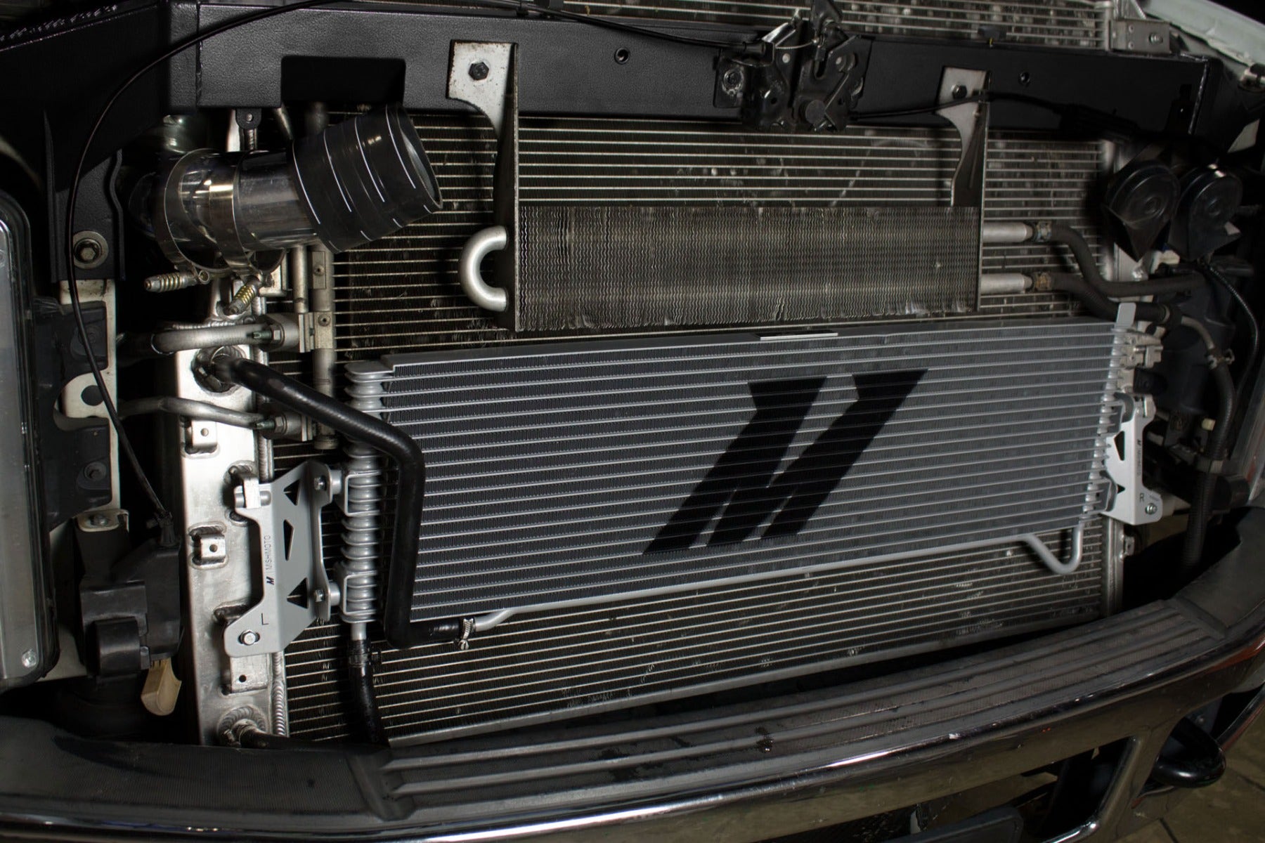 Mishimoto transmission cooler installed on a diesel truck.